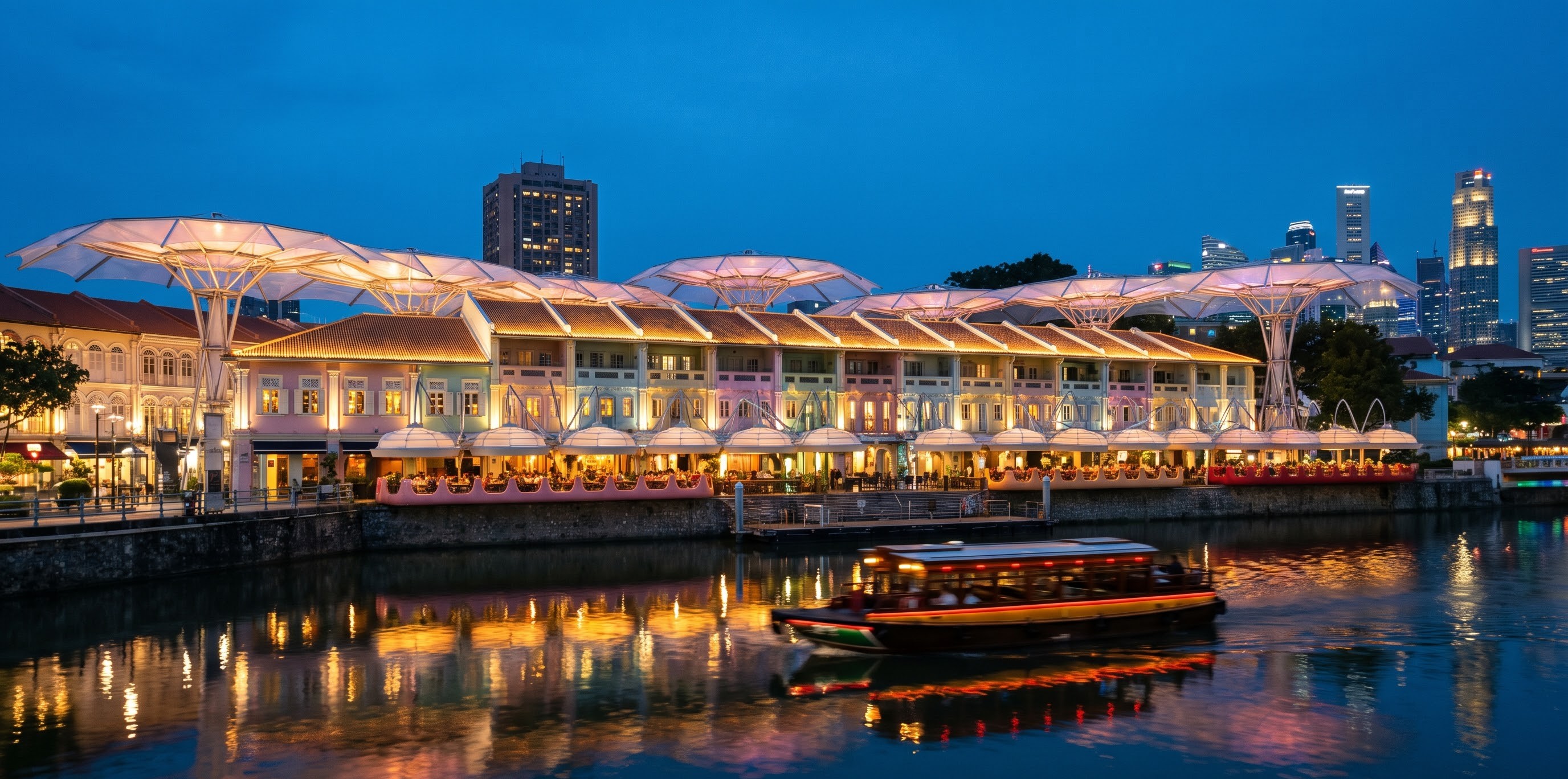 Restored candy-coloured shophouses along Clarke Quay lit up at blue hour, reflected in the Singapore River with a red-roofed bumboat passing Restored candy-coloured shophouses along Clarke Quay lit up at blue hour, reflected in the Singapore River with a red-roofed bumboat passing