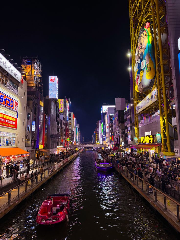Vibrant evening view of Dotonbori canal neon signs in Osaka Japan Vibrant evening view of Dotonbori canal neon signs in Osaka Japan